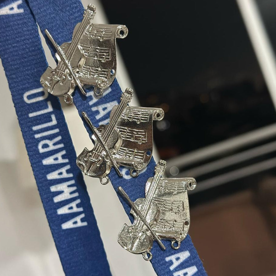 Pin musical violín + pentagrama