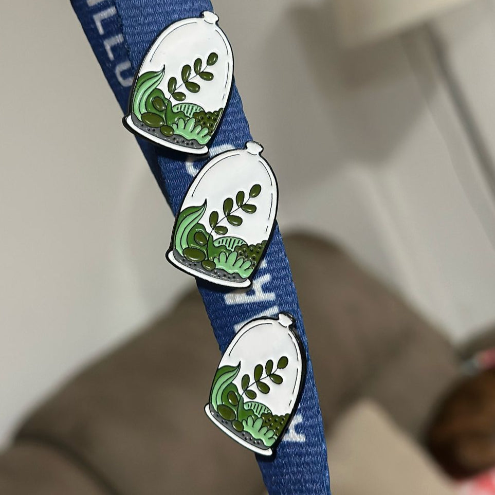 Pin planta en recipiente