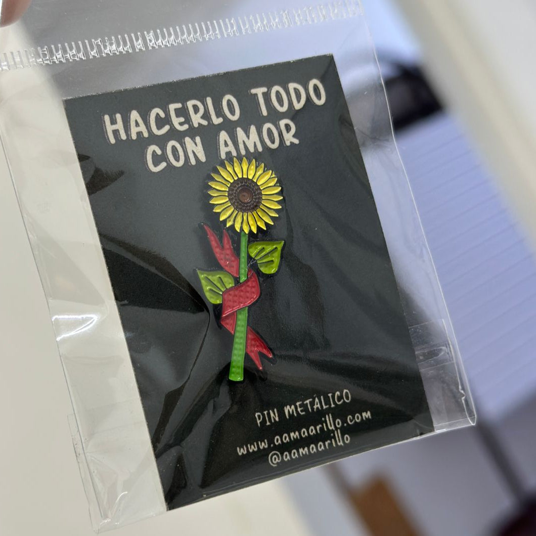 Pin girasol banderín rojo
