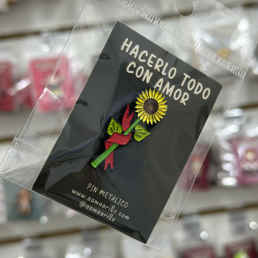 Pin girasol banderín rojo