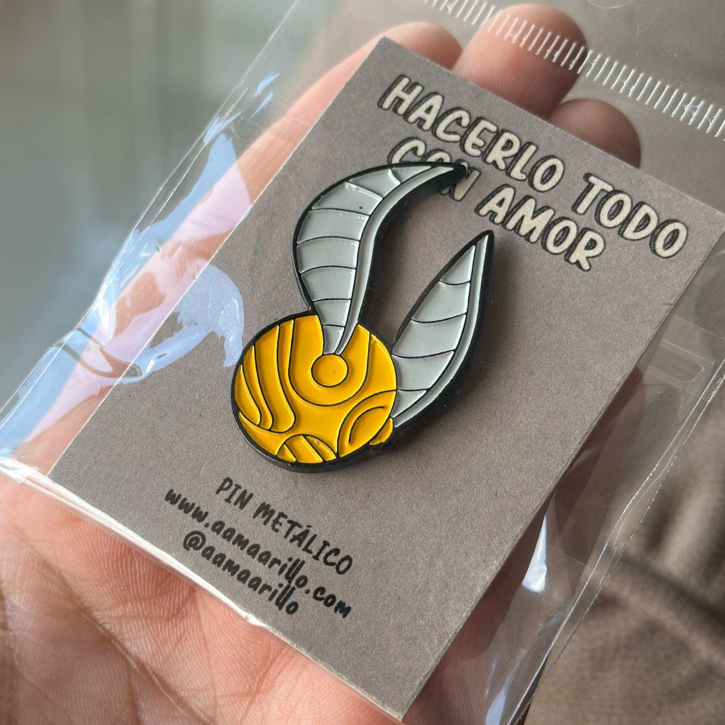 Pin Snitch Dorado