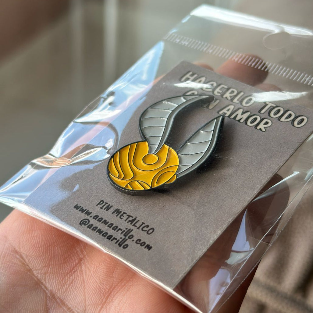Pin Snitch Dorado