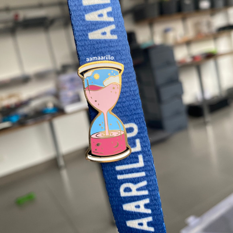 Pin reloj de arena estelar