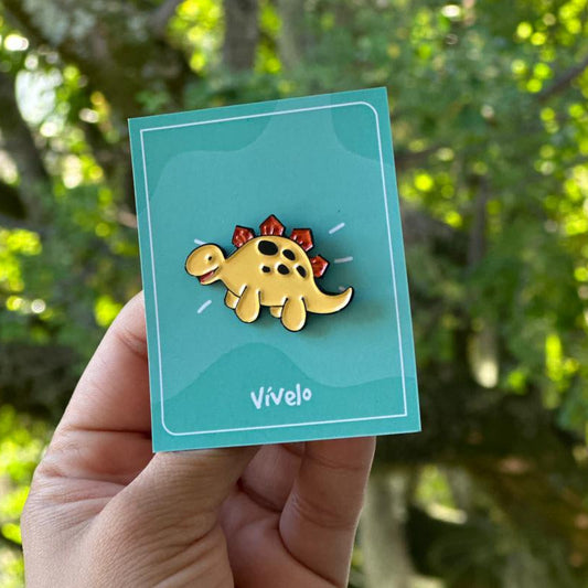 Pin dinosaurio amarillo claro