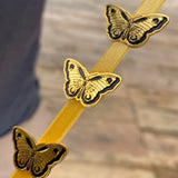 Pin mariposa negro/dorado